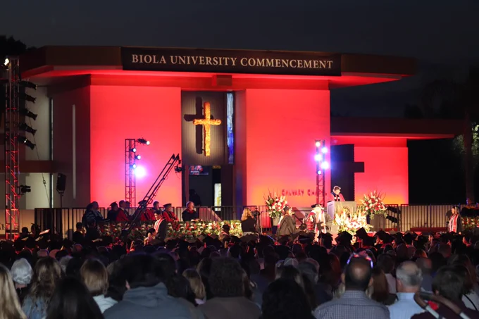 The Commencement stage lit up at night.