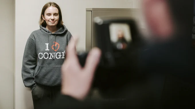 Junior Grace Gawecki poses for her application photo at the UNL Passport Office. Gawecki was one of 88 students who received funding through the first Husker Passport Giveaway in 2020 to apply for her first U.S. passport.