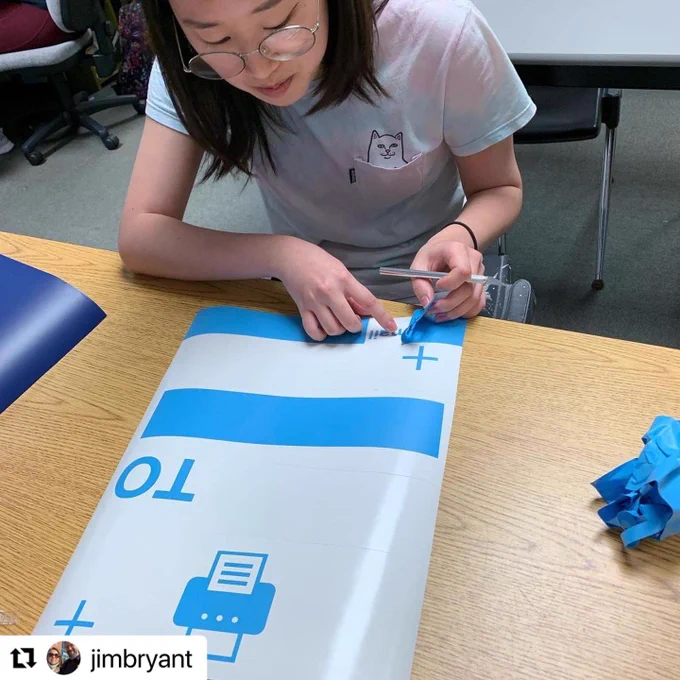 Student working on a sign