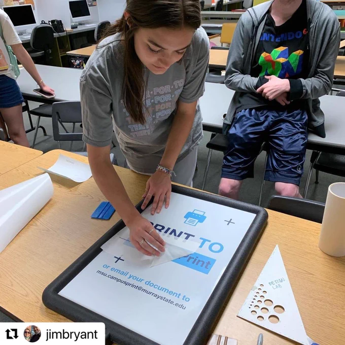 Students working on a sign