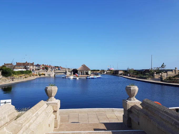 The Venetian Waterways showing the lake and a clear blue sky.