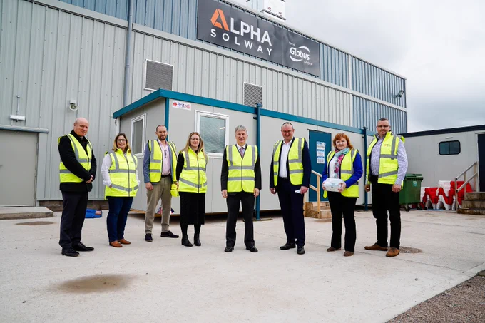 Members of Alpha Solway, South of Scotland Enterprise and Scottish Government join Business Minister Ivan McKee MSP at the entrance of Alpha Solway's new Dumfries factory