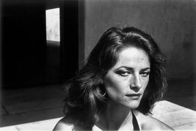 Black and white image of beautiful woman looking seriously at the camera