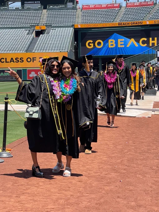 Students march into Angel Stadium to begin the 2022 commencement ceremonies for CSULB's College of Natural Sciences and Mathematics.