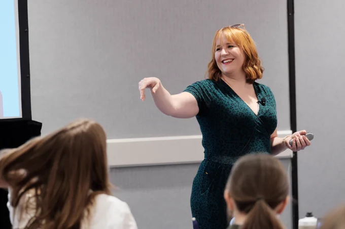 Tracy Playle smiles at the workshop crowd. 