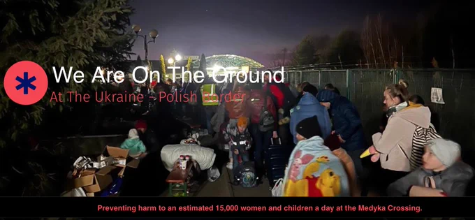 Copyright Rob Moore MitMark  People, including women and children at night being helped by our team at the Medyka Crossing and while waiting in line, to cross from Ukraine to Poland. 