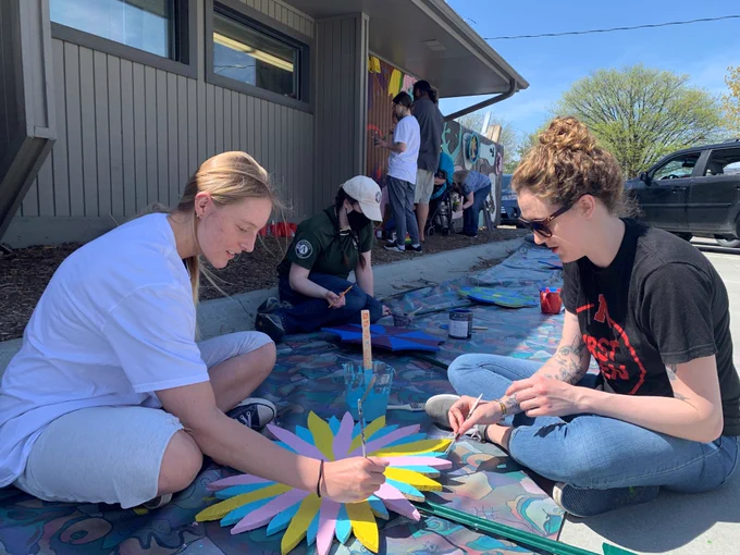 UNL PC Prep students Kenzie Steiner (left) and Katie Schmitz (right) paint a mural. 