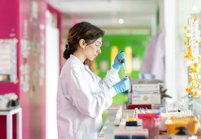 A scientist working at a bench