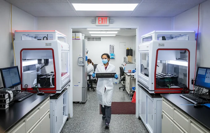 University of Illinois Urbana-Champaign SHIELD team members process saliva samples, testing for COVID-19 as they run the university testing program in labs across campus.