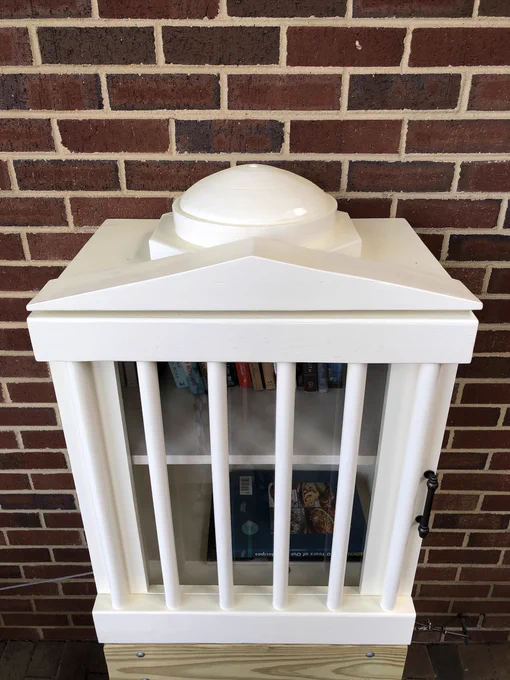 Little Free Library pictured close-up and at a higher angle. 