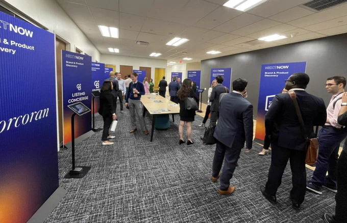guests mingling by kiosks 