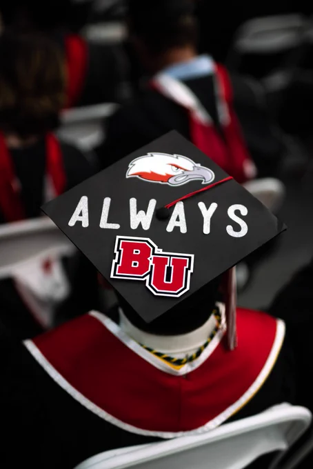 Decorated grad cap that says "Always BU."
