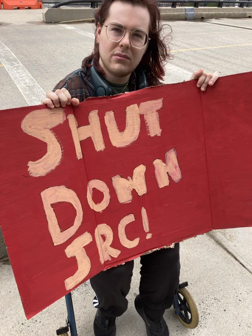 ADAPTer with sign that reads SHUT DOWN JRC