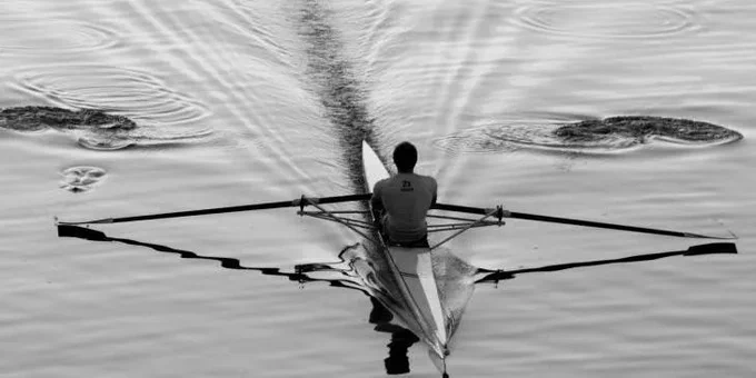 single sculler on water