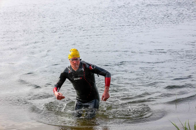 Stewarty Boy emerging from the water at the end of the Swim during an aquathon [swim / run race]. 