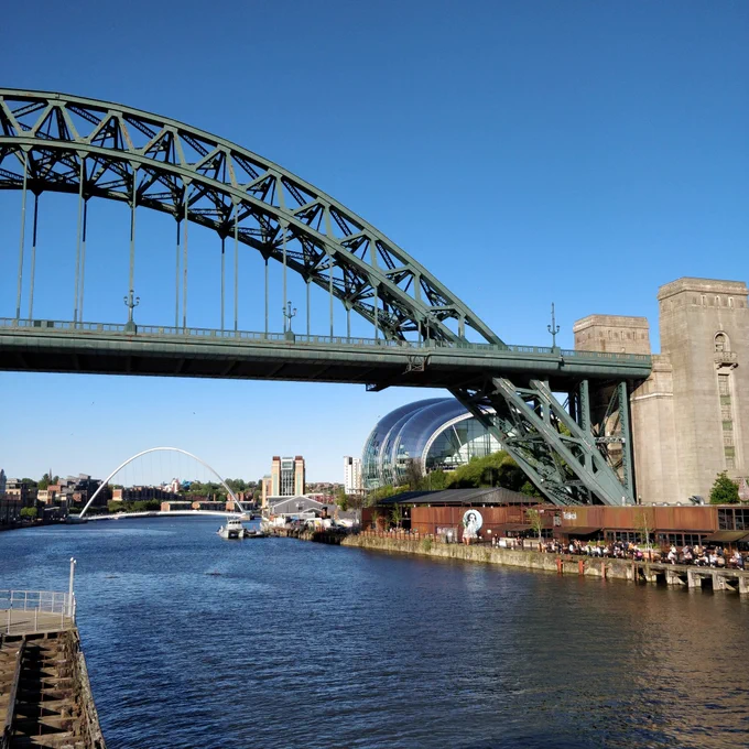 Tyne Bridge in the sunshine, with the Sage Gateshead behind