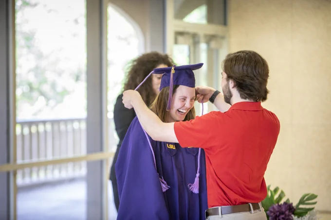 A graduate received a lavender cord at the Lavender Graduation ceremony.