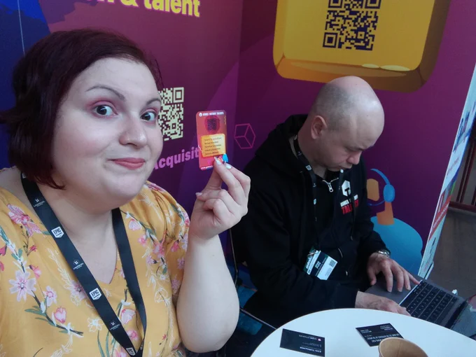 Vasia holding a business card for the shot and looking ready to reach some folks while Oleg is doing important things on his laptop.