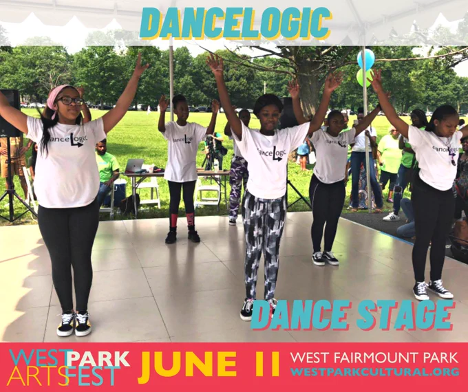 Young women of color dancing on stage at the West Park Arts Fest, dressed in white t-shirts with the danceLogic logo and black leggings. The green grass and trees of western Fairmount Park are the backdrop.