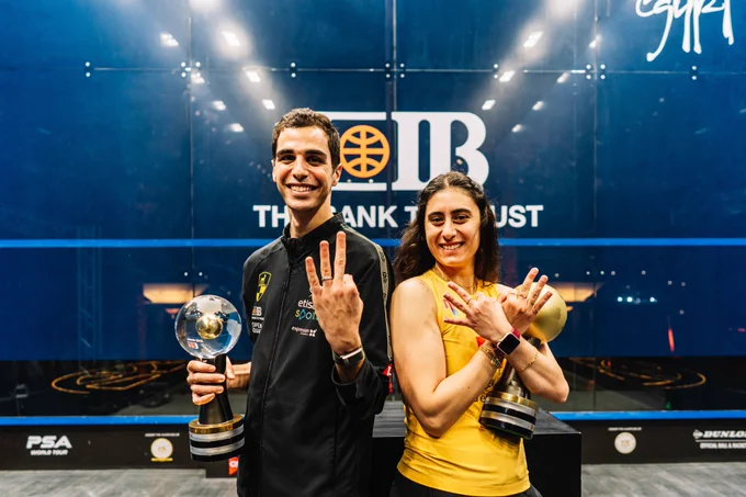 Ali Farag and Nour El Sherbini with the 2022 CIB PSA World Championship trophies