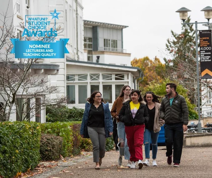 A group of students waking around Park Campus, What Uni Awards logo in corner