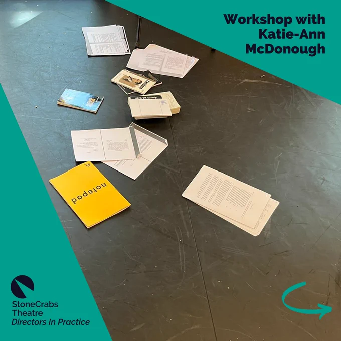 A square which has a teal background with a spotlight shining from the upper left corner which has a photo in it. The photo is of a selection of notebooks splayed out on a black floor. A teal arrow in the bottom right corner points right. Dark indigo text in the upper right corner reads: Workshop with Katie-Ann McDonough.