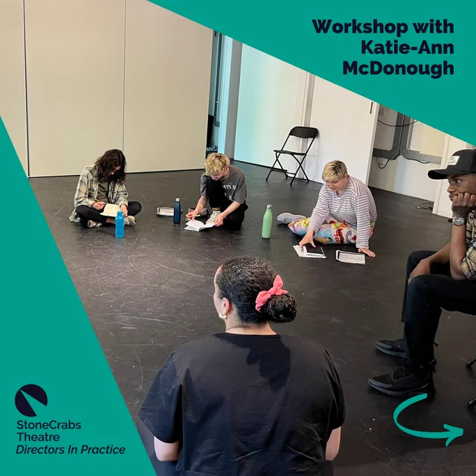 A square which has a teal background with a spotlight shining from the upper left corner which has a photo in it. The photo is of a diverse group of young people sitting on a black floor while reading and writing in notebooks. A teal arrow in the bottom right corner points right. Dark indigo text in the upper right corner reads: Workshop with Katie-Ann McDonough.