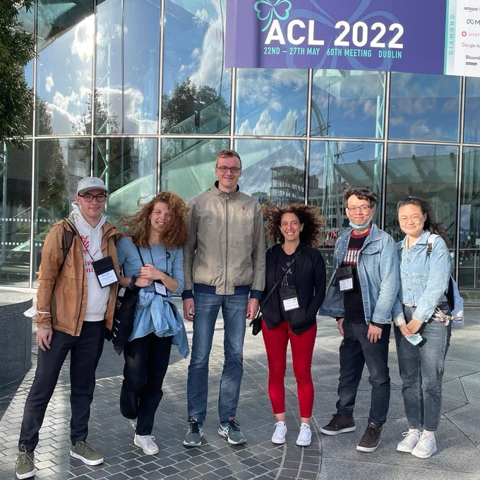 Members of the Computational Linguistic Group at the University of Groningen posing in front of a "ACL 2022" banner in Dublin after the end of the main conference of the Association for Computational Linguistics.