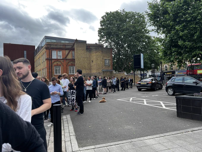 People queuing for free ice cream and beer