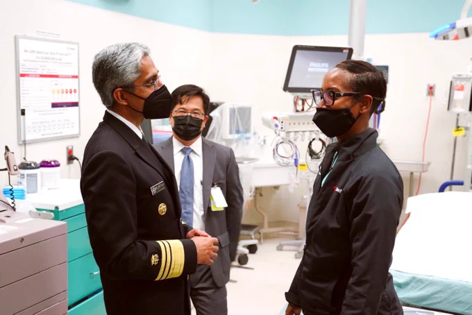 U.S. Surgeon General Vivek Murthy meeting with a health worker at Grady Hospital.