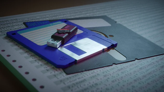 Computer generated image of a SD card on a USB stick on a 3 1/2 inch floppy disk on a 5 1/4 inch floppy disk on some printer paper.