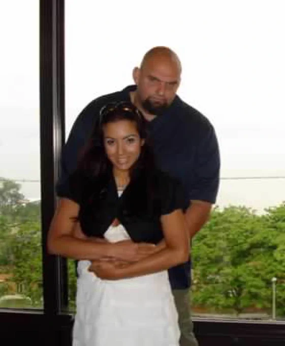John Fetterman embraces Gisele Fetterman after eloping.