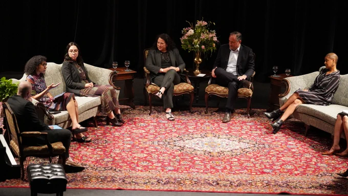 Six people sitting indoors.