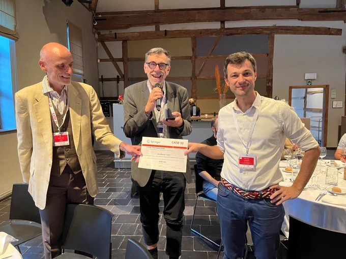 CAiSE PhD Award 2022. Unfortunately Volodymyr Leno could not attend CAiSE 2022 in person, so the voucher was given to Marcello LaRosa, his supervisor at U Melbourne. 
Photo (from left to right): Ralf Gerstner (Springer), Prof. Johann Eder (CAiSE Steering Committee), Prof. Marcello LaRosa (Supervisor)