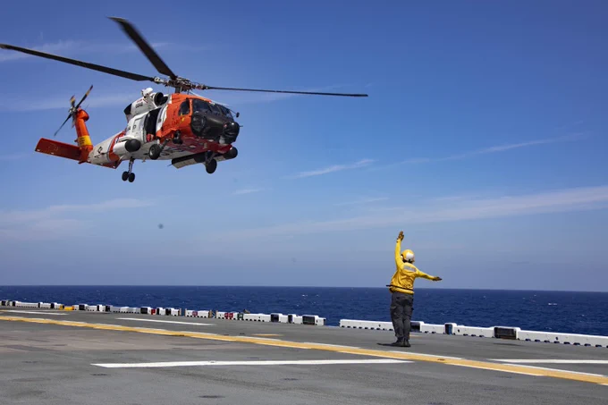 A U.S. Coast Guard MH-60 helicopter takes off from USS Bataan (LHD 5) in the Atlantic Ocean. 📸 Mass Communication Specialist 1st Class Zachary A. Anderson 