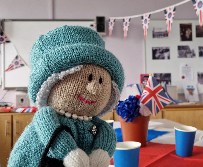 Knitted figure resembling the Queen