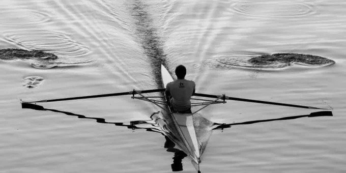 single sculler on water