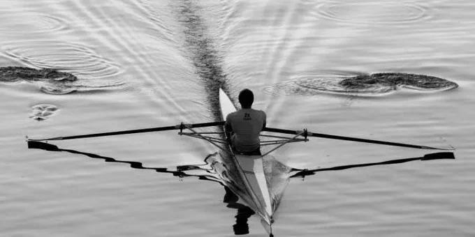 single sculler on water