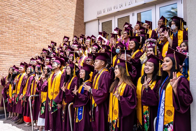 Group of students flashing their pitchforks after AAPI Convocation.