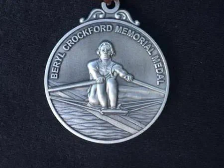 medal with embossed image of single sculler. Text: "Beryl Crockford Memorial Medal"