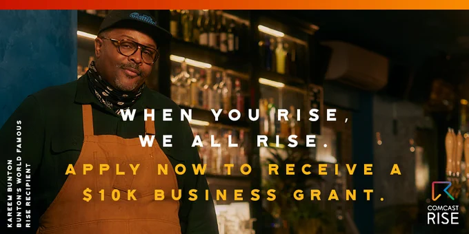 Male business owner in restaurant being featured for the Comcast RISE event 