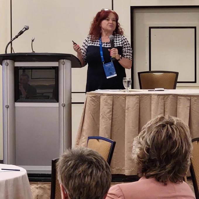 Nikki Langdon presenting on stage at the CELEBRATE! VRA Canada 2022 Conference