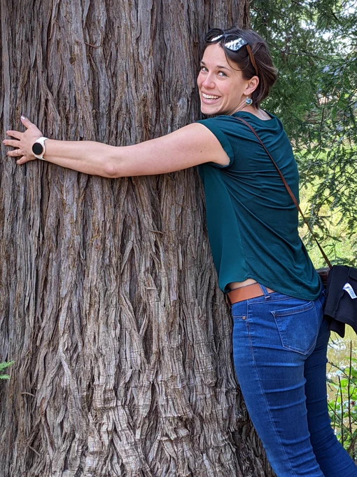 Woman hugging a tree