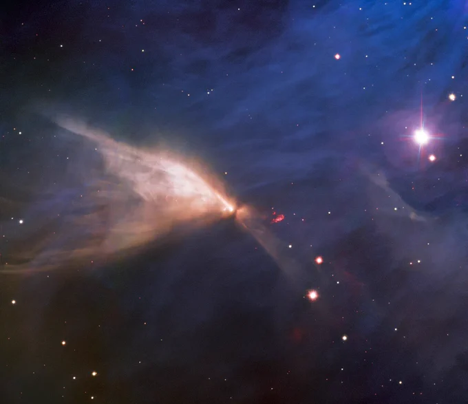 Nebula powered by a young star obscured by a circumstellar disk.