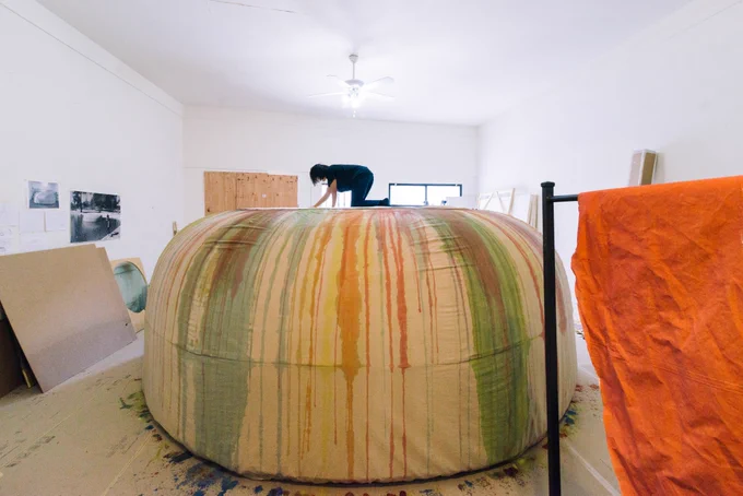 Artist Carmen Argote is above sculpture titled, Filtration System for a Process-based Practice. 