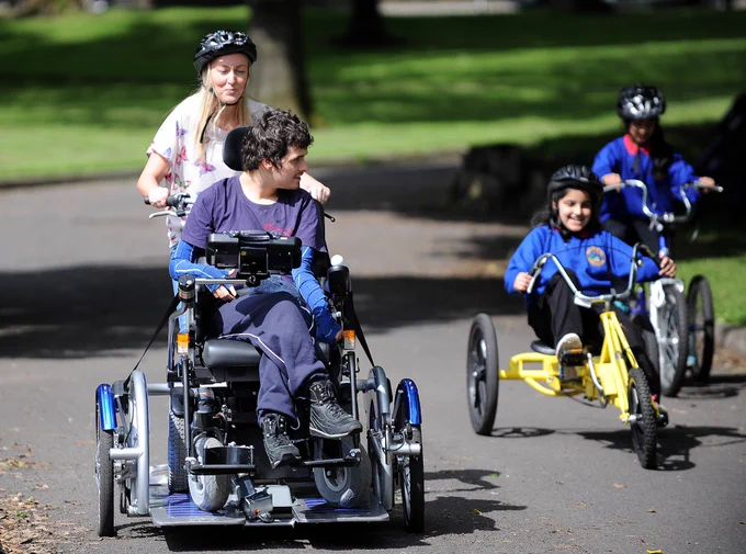 A group taking part in adapted cycling