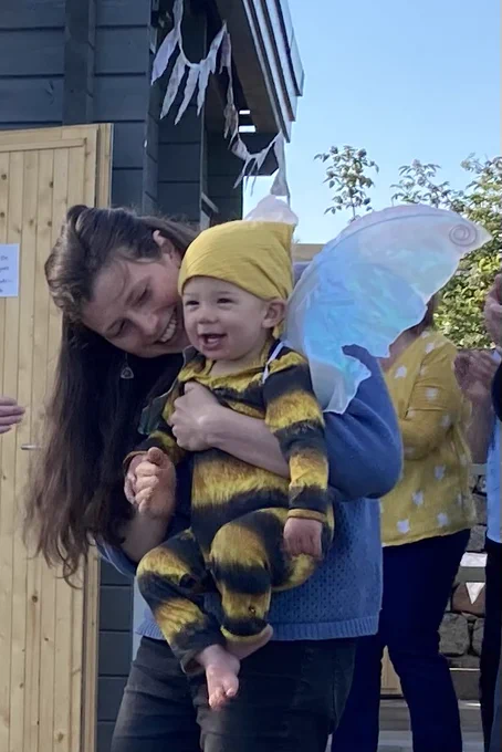 John, whose mum was involved in the project, is dressed as a bee as he plays his part in the official opening. 