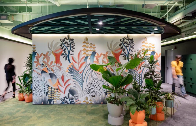 Mural wall in hub area with plants