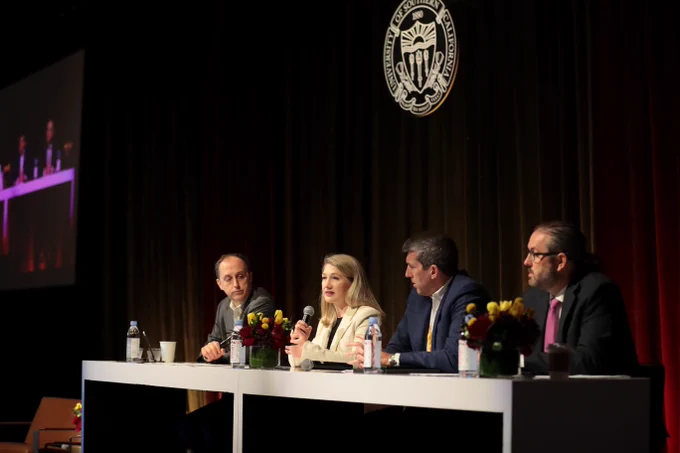 panel of 4 people on stage
