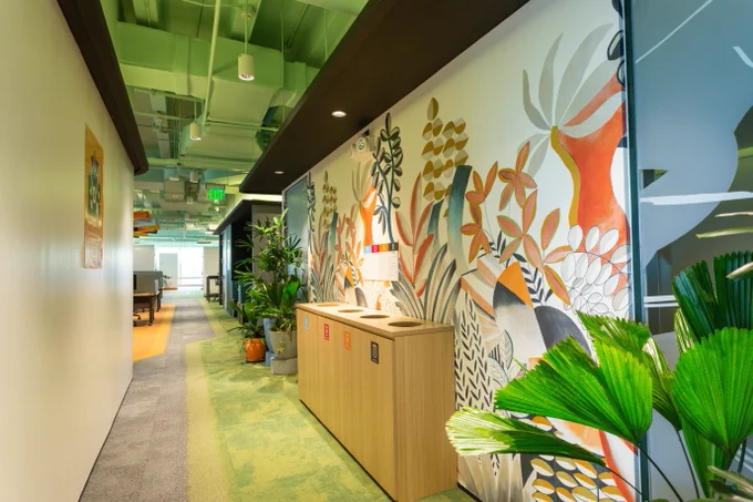 Hallway in Microsoft Makati showcasing a mural with flowers and plant life 
